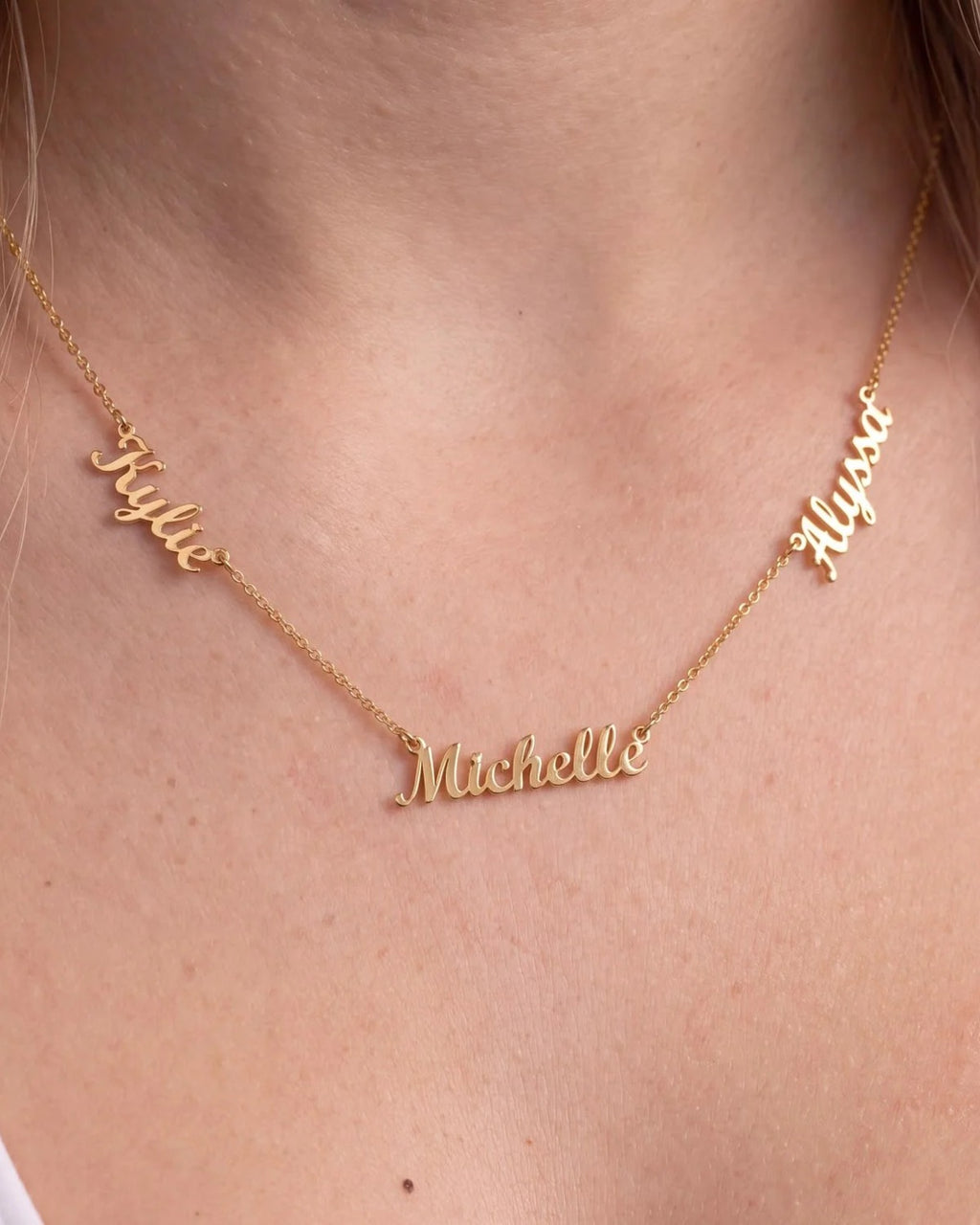 Three-name necklace worn close up: Kylie, Michelle and Alyssa