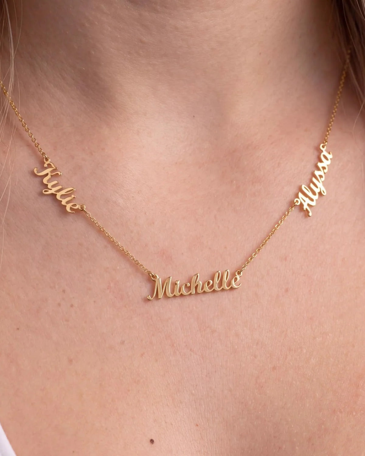Three-name necklace worn close up: Kylie, Michelle and Alyssa
