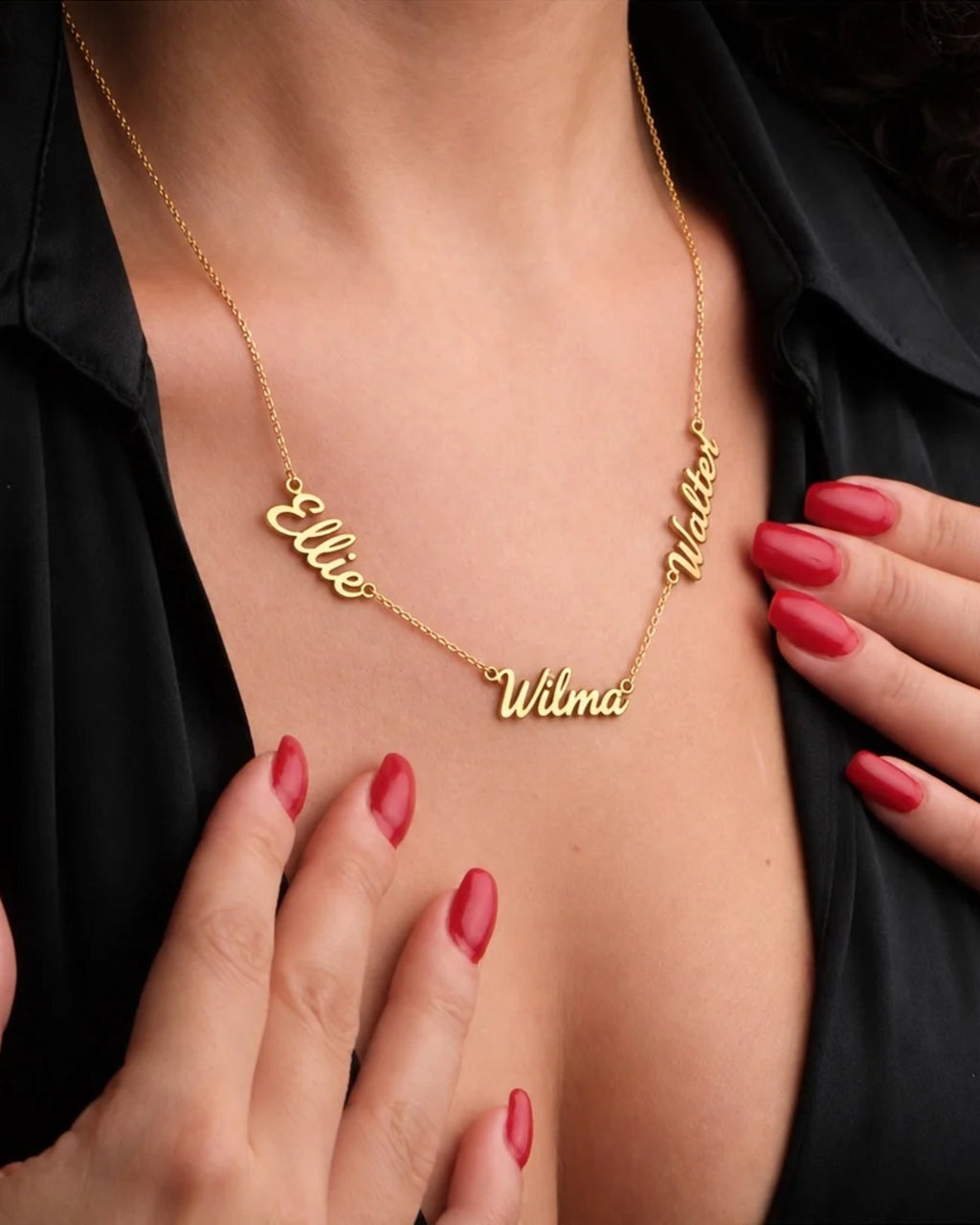 Woman wearing a gold necklace with the names Ellie, Wilma and Walter